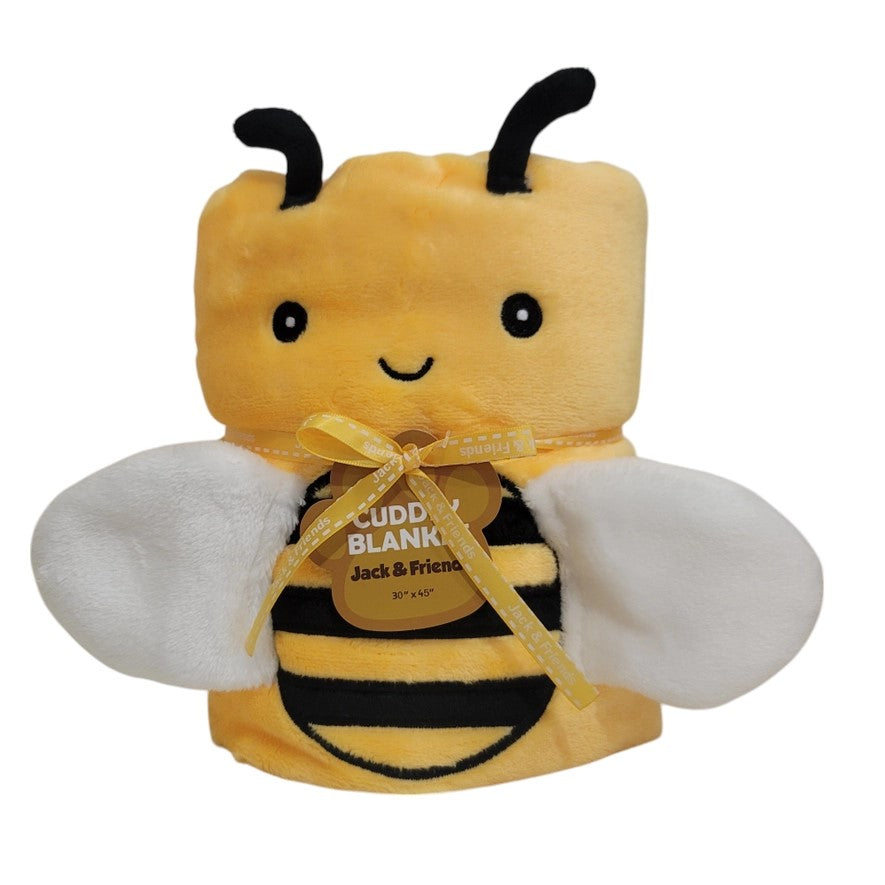 A plush baby blanket with a bee motif, featuring a smiling face, black antennae, and yellow and black body resembling a bee. The blanket is tied with a ribbon and has a tag showing the brand 'Jack & Friends'.
