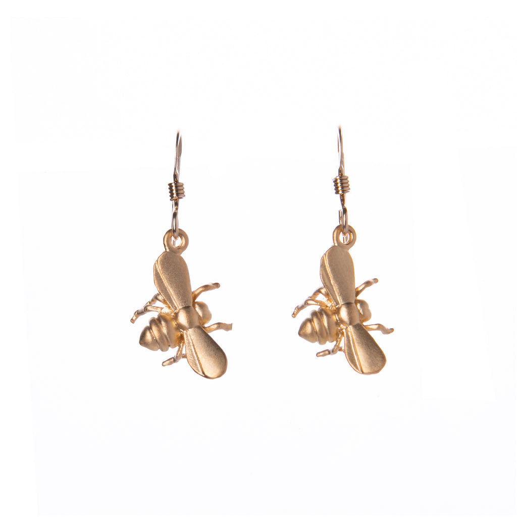 Create a buzz for all the right reasons with these bee-autiful bee earrings. These perfectly petite pollinators are handcrafted in the USA and are plated with 16k gold. 16k gold plated. Gold filled ear wires. Size approx: 0.5" x 3/8".