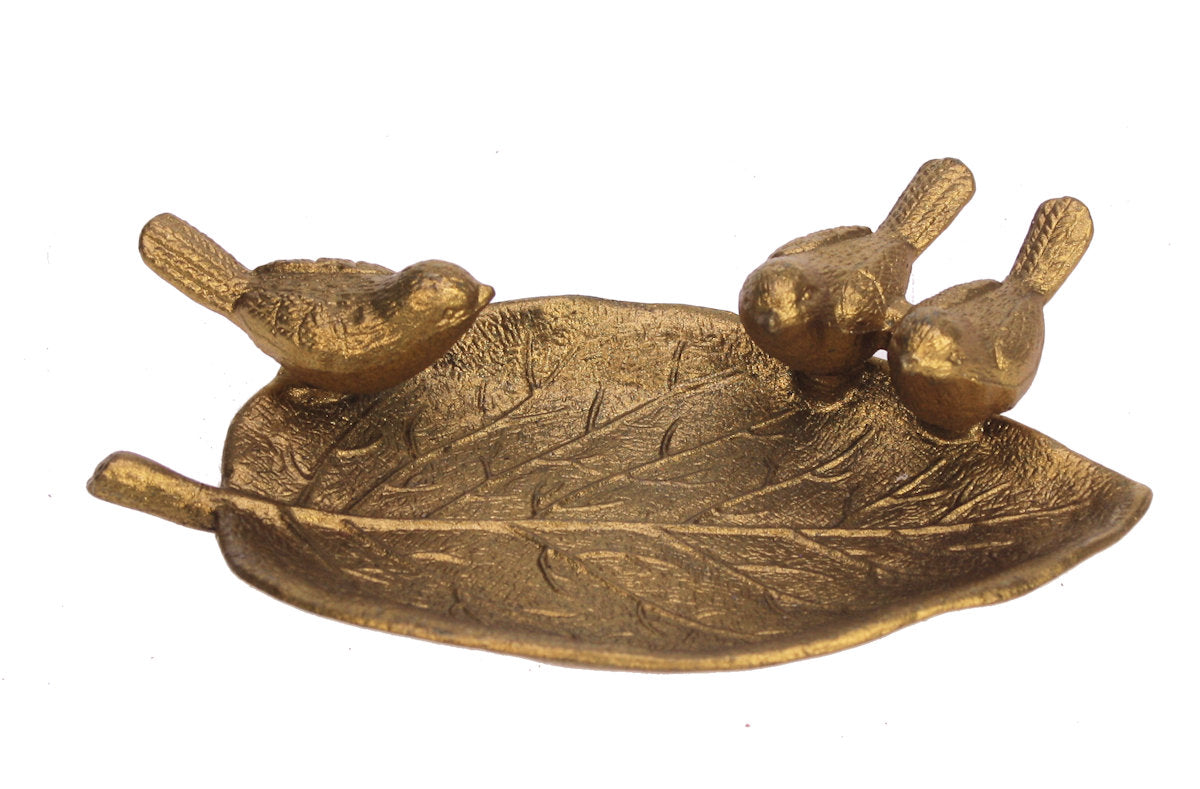 Featuring an up-curled leaf and three little birds, this pretty dish is the perfect catch all for jewelry, coins and other small items, or simply use as a home decor piece. It is made from a heavy-weight metal alloy, and with a bright gold finish. Metal alloy with gold color finish Dimensions: 5.5" x 3" x 1 1/4".