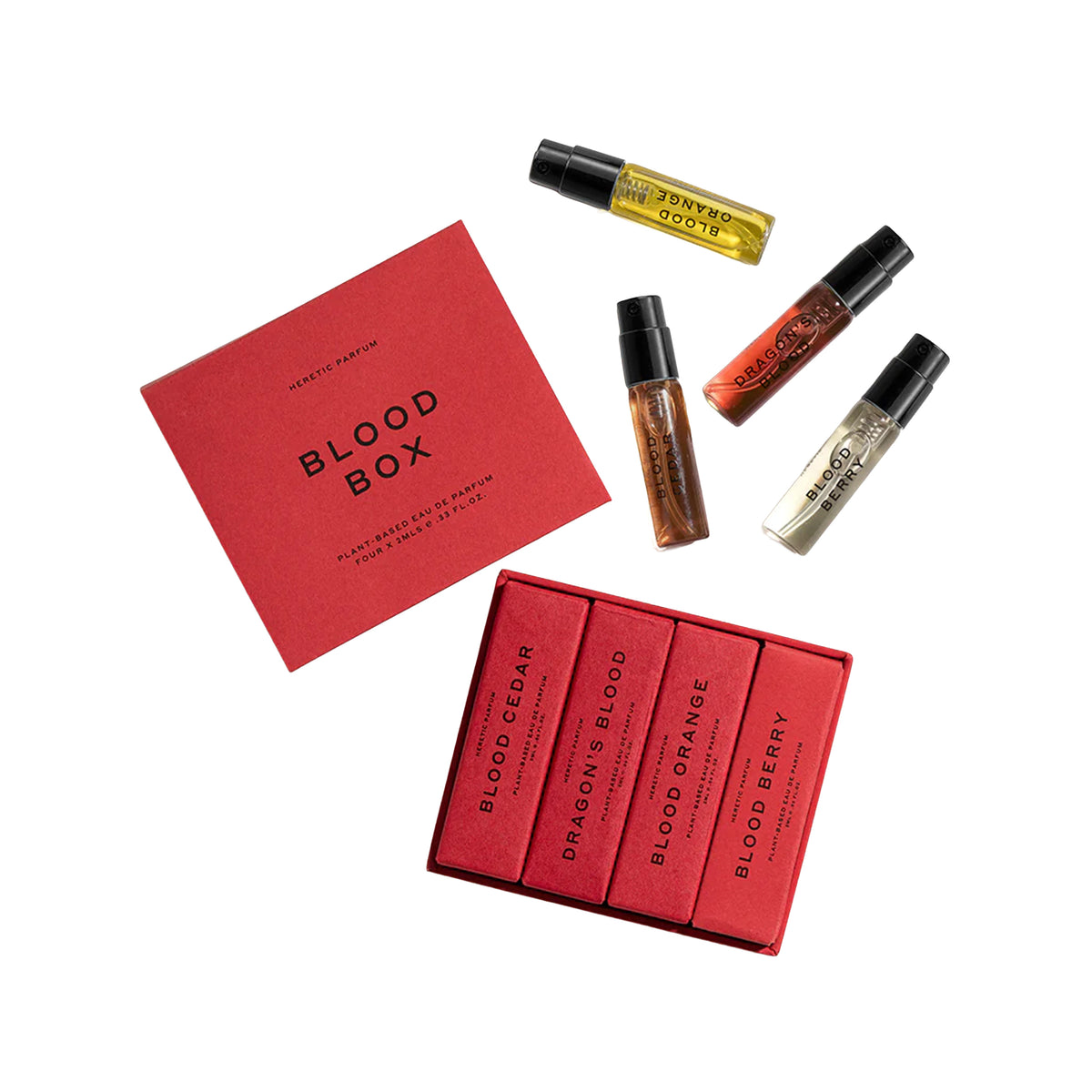 A perfume gift set labeled Blood Box by Heretic Parfums, featuring a red outer box, a red inner box with four red sample vials, and three additional sample vials scattered above on a white background.