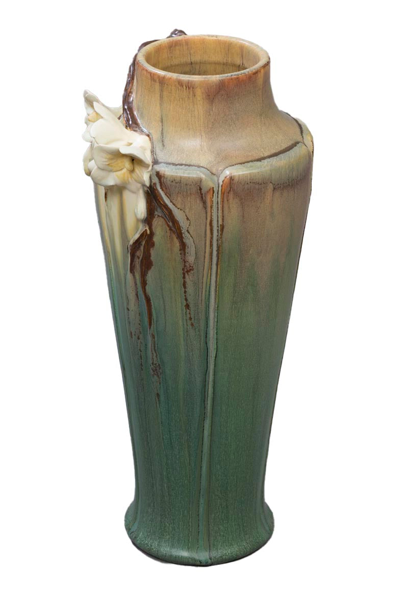 Before leaves broaden and fruit forms, trees greet spring with their beautiful blooming branches. This vase celebrates the dramatic beauty of a single blooming branch, which rests on the shoulder of a subtle and elegant, architectural vase. Thrown, sculpted and glazed by hand Size approx. 12" x 5".