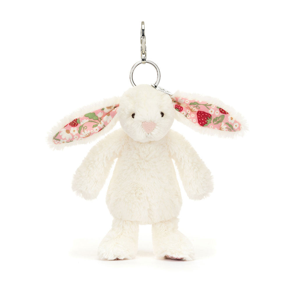 Blossom Cream Bunny Bag Charm has been hopping around the garden. This pocket-sized Blossom Cream Bunny is soft in iconic Bashful fur, and has soft cotton ears, printed with an original Jellycat design of juicy strawberries and cream flowers on a pink backdrop. Use the silver clasp to attach bunny to any bag for the perfect outdoor adventure companion. Dimensions: 7.1" x 2" x 1.6".