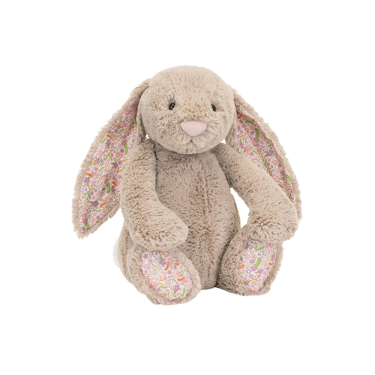 A plush stuffed Jellycat blossom bunny in warm beige with long floppy ears and pink floral-patterned inner ears, photographed on a plain white background.