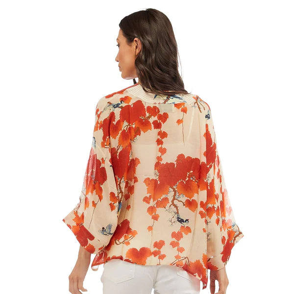 This gorgeous, vibrant print features the beautiful ornamental foliage of the Japanese maple tree with bold scarlet and orange tones and colorful birds on a rich ivory base. This one-size, loose-fitting kimono style jacket has ¾ length sleeves, an open front and a lightly embroidered lapel. One-Size Fits Most.