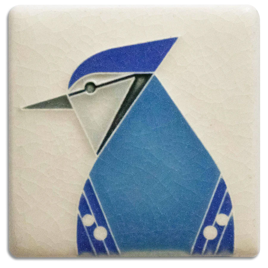 This charming little blue jay mini tile features a whimsical design by famed wildlife artist, Charley Harper. Midcentury modern meets Motawi mastery in this charming series of 3"  x 3" art tiles. As each Motawi tile is crafted by hand, dimensions may vary slightly by up to 1/16".