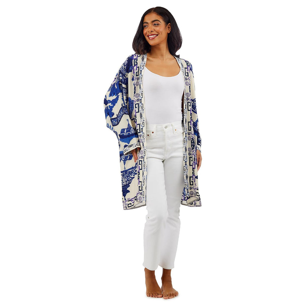 The perfect summer cover up, in a classic 'Blue Willow' print. This has a beautifully gauzy feel, is lightweight enough to fold up and pop in your purse, but also heavy enough to keep the chill off when the sun goes down. 50% Modal, 50% Tencel. One size fits most. Measures 21"W x 37"L. Hand wash.