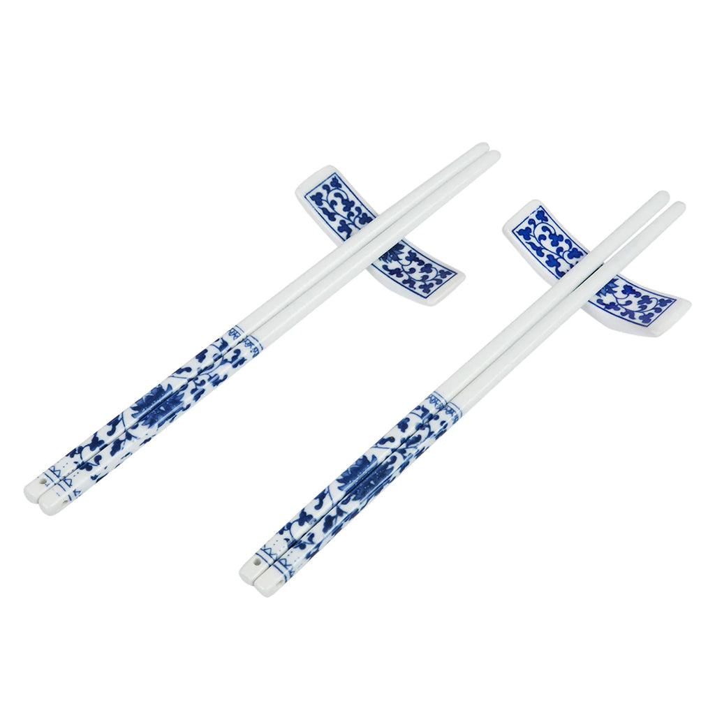 This attractive, Blue Willow style chopstick set contains two sets of porcelain chopsticks and two chopstick rests, packaged in a traditional patterned gift box with golden yellow sating lining. A perfect birthday, housewarming or hostess gift.  Chopstick length: 9.5". Gift box size: 11" x 3.5" x 1".