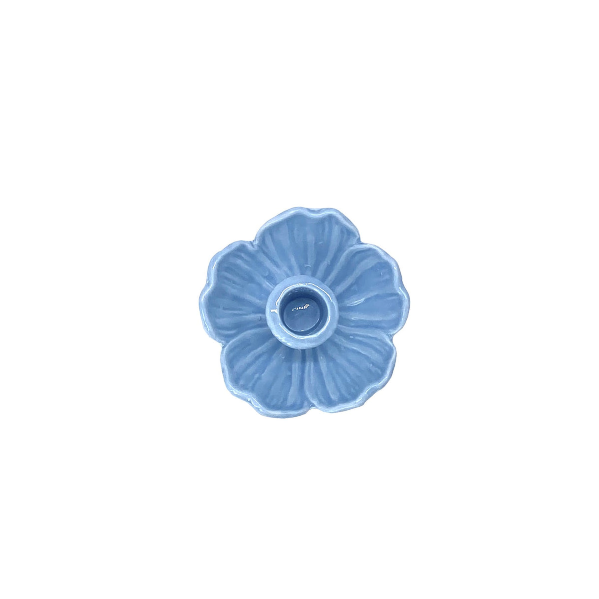 Blue ceramic flower-shaped candle holder on a white background