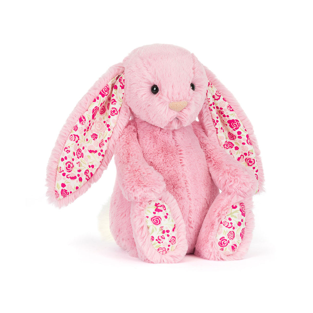 A pink plush Jellycat Blushkin bunny toy with long floppy ears and floral-patterned inner ears, sitting on a white background.