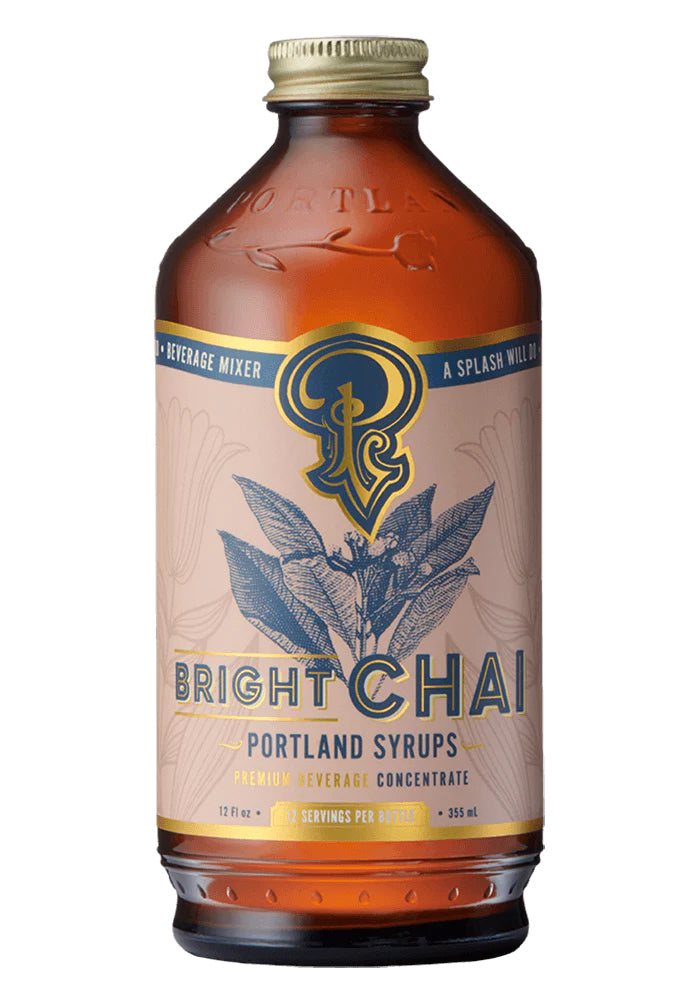 Crafted with a blend of warming spices and Orange Pekoe black tea, this classic chai syrup is perfect for adding a touch of tradition to your holiday drinks. Enjoy it in hot beverages or mix with ice-cold sparkling water for a refreshing twist. A premium small-batch syrup brewed by hand in Oregon. 12 fl oz bottle.