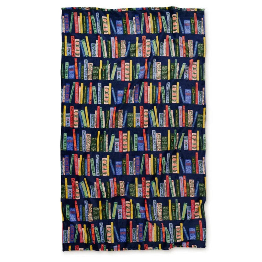 Folded blanket with colorful text pattern and red binding on a white background