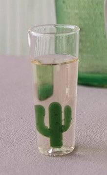 Add a touch of desert charm to your barware collection with this unique shot glass featuring a miniature glass cactus inside. Perfect for serving up tequila shots or other fun cocktails at your next gathering. Material: glass Dimensions: 4.25" x 1.5"