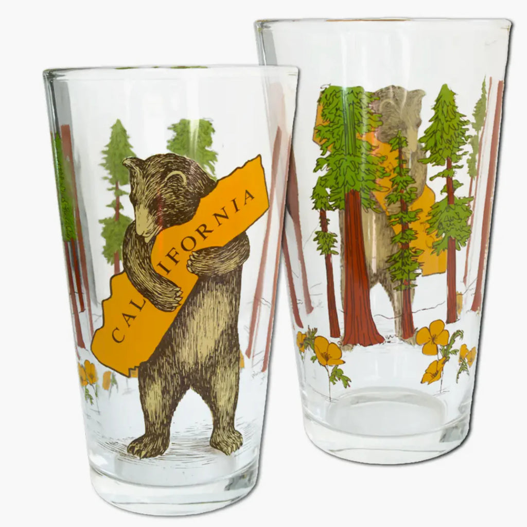 The design for this state-themed pint glass was inspired from the 1913 vintage sheet music cover of the California state song, "I Love You California!", with a glade of peaceful California redwoods on the opposite side for good measure. 3.5" x 3.5" x 5.75". Dishwasher safe but hand wash recommended. 16 oz.