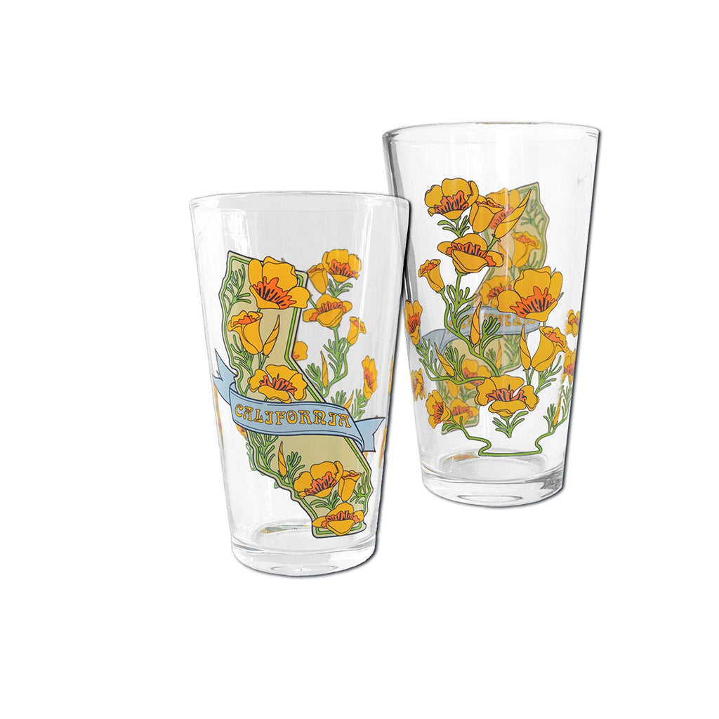 This California themed pint glass features our state flower, the poppy, alongside an outline of the state. This with double sided decal was designed by local California artist Ethel Martinez. Holds 16 oz. Dishwasher safe but hand washing recommended. Do not microwave. 3.5" x 3.5" x 5.75".