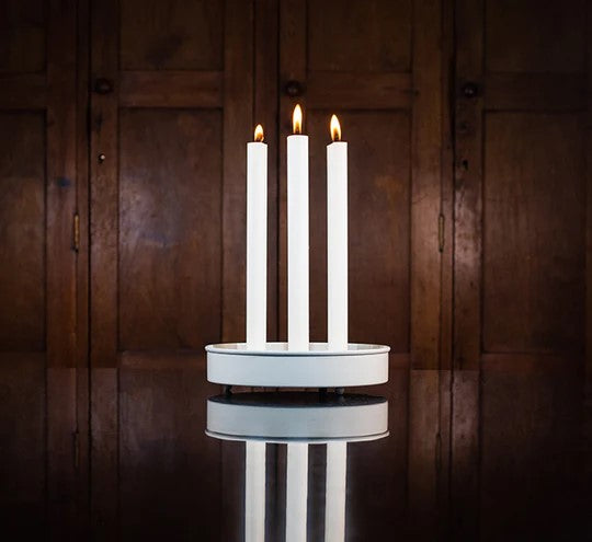 This striking yet straightforward candle holder will help you effortlessly create a stunning table centerpiece. Simply add taper candles, and if desired, flowers or other decor at the base. The sleek, neutral design makes it easy to customize for any occasion. Material: Powder-coated steel Dimensions: 8" diameter, 1.5" depth