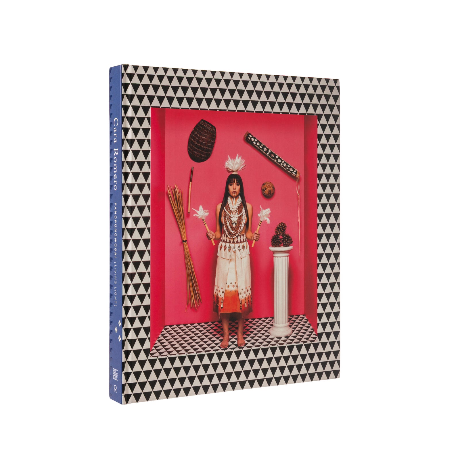 Book cover with a geometric pattern and a central image of a person in traditional attire on a red background by the artist Cara Romero. 