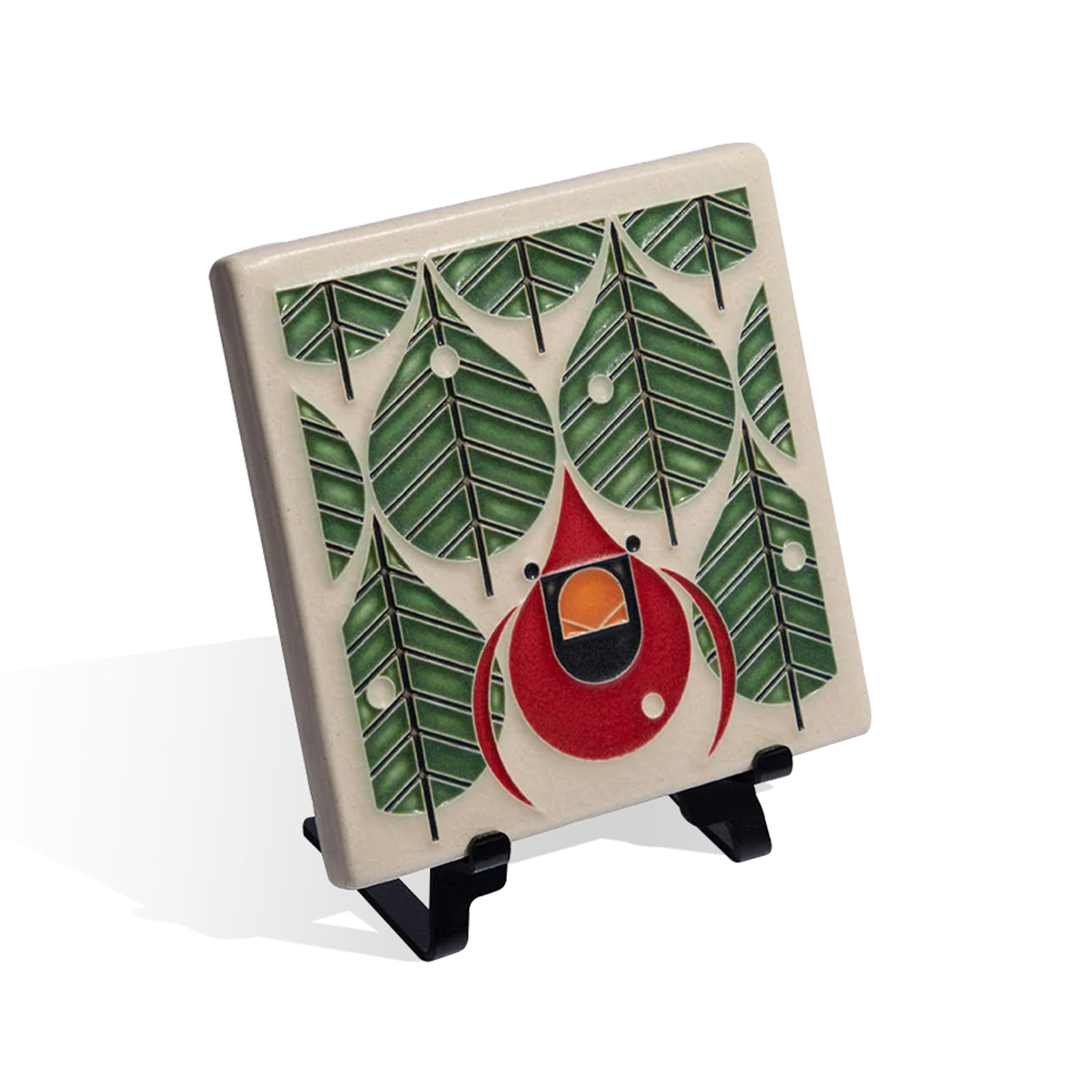 Decorative tile with red cardinal bird design and green leaf patterns on a white background