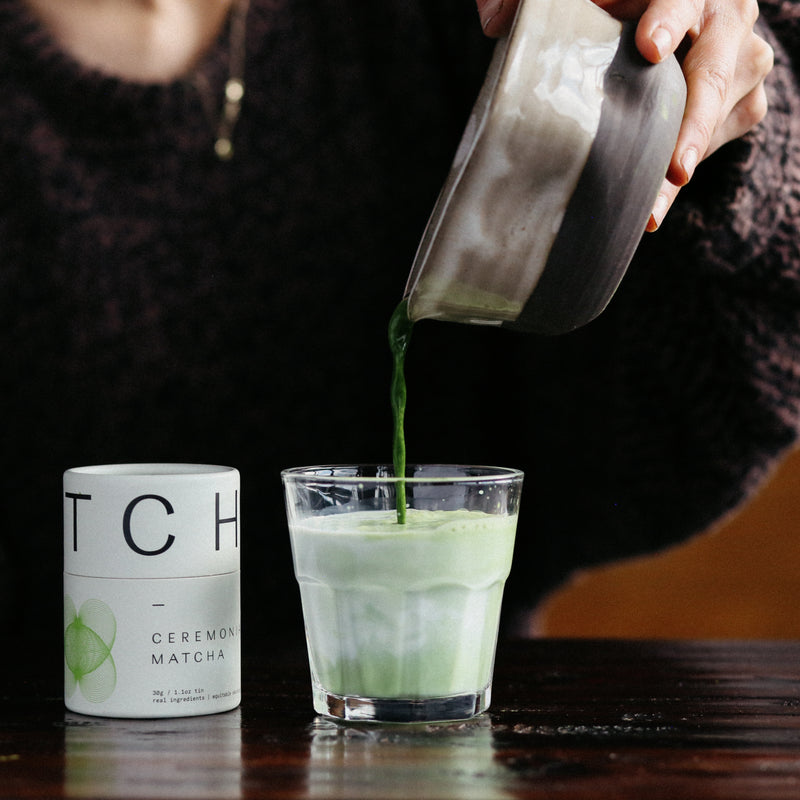 Ceremonial matcha container with 'MA' branding on a white background