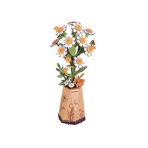 Wooden model kit of a decorative vase with a chamomile flower design on a white background.