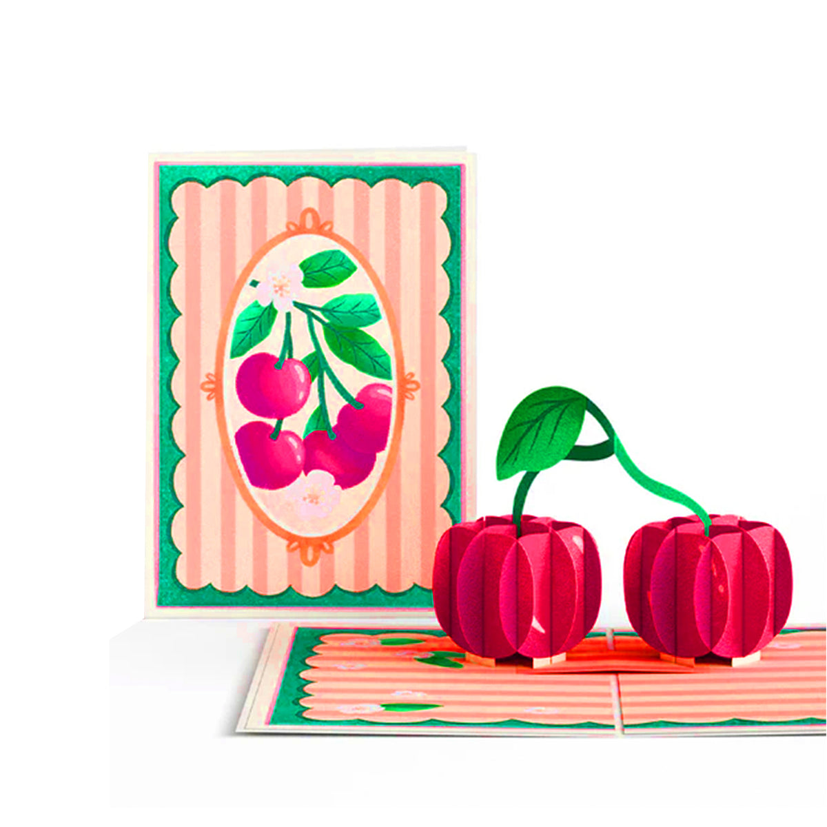 Card with cherry design and cherry-shaped candles on a white background