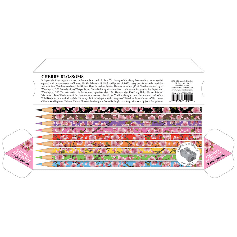 A set of nine multicolored pencils with cherry blossom designs, accompanied by a metal sharpener, all packaged in a triangular cardboard box.