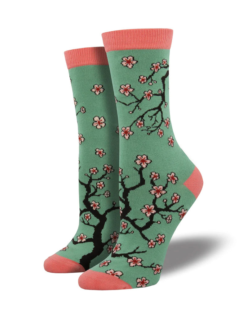 Since the magnificent cherry blossoms symbolize renewal, maybe this is a sign your sock drawer needs a revamp? These socks feature beautiful pink blooms on a green background with a peachy pink heel and toe. Made with sustainable bamboo fiber. 100% free of harmful chemicals. Women's shoe size 5 - 10.5.