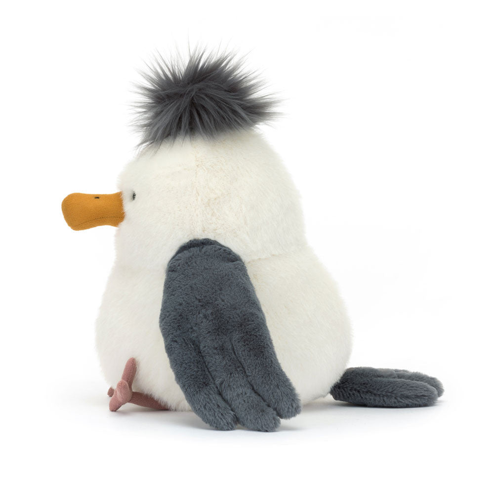 Chip Seagull is a top beach bird. In soft cream fur with dark grey wings, Chip has thin, suedette legs and a dark grey tuft. With a curved mustard suedette beak, Chip is ready for a beach picnic or two this summer! Dimensions: 9.8" x 5.5" x 6.7". Sitting Height: 9" Care Instructions: 86-degree Fahrenheit wash only. Do not tumble dry, dry clean, or iron. Check all labels upon arrival of purchase Safety Recommendations: Not recommended for children under 12 months due to fiber shedding