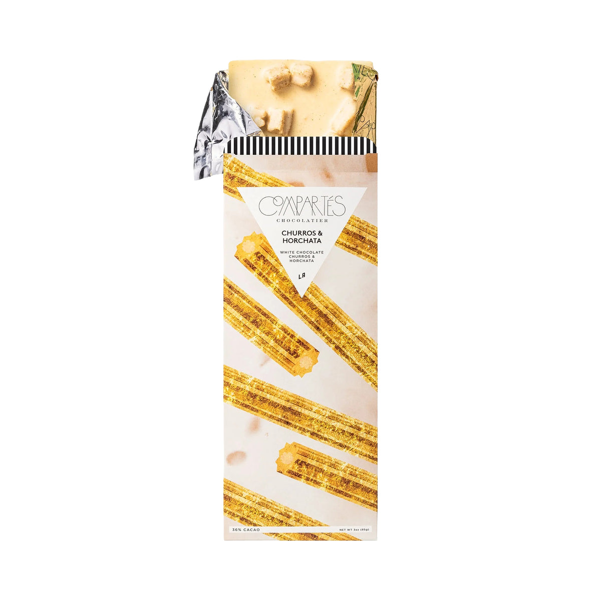 Packaged white chocolate bar with churros with horchata on a white background