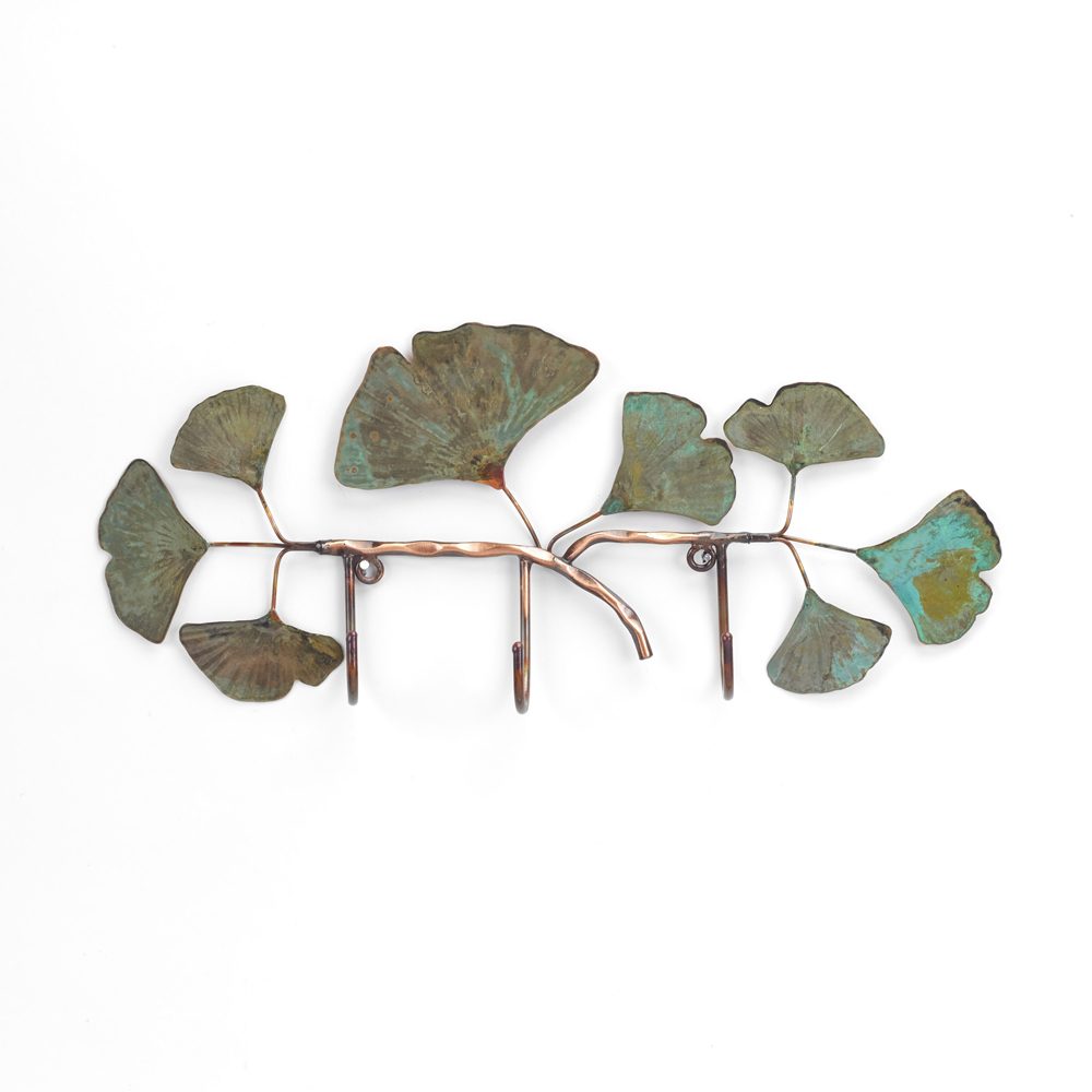 This Gingko Rack is a functional yet beautiful addition to any room. The piece is 12″ wide with 3 hooks can be used in a kitchen, by a pool or to hang jewelry, hand towels or light clothing. Made from beautiful copper metal, it has a beautiful sea-green hand patina finish. H-5″ x W-12″ x 1.5″ Hand made in the USA.