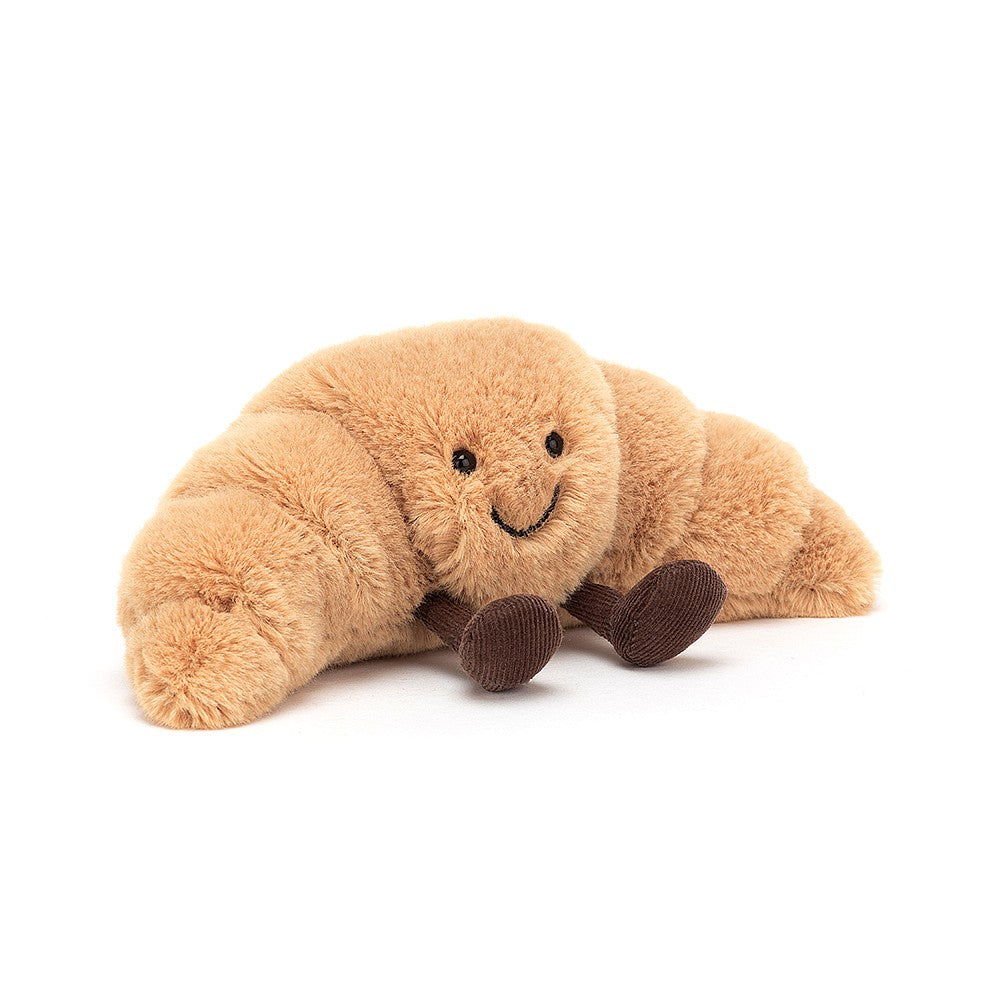Bonjour, mes amis! Un petit dejeuner? Amuseable Croissant is a crusty cutie - all golden and fluffy with soft pastry knobbles. This delightful scamp has a big sunny smile and cordy boots au chocolat! Rise and shine with a cuddly croissant. Suitable from birth. Hand wash only. Dimensions: 8" x 3".