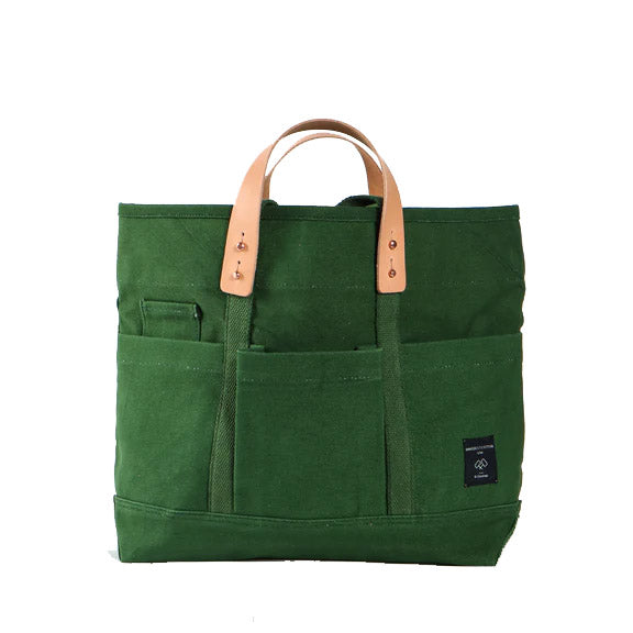 Tuck away your water bottle and keys in the front pockets, your paint brushes in the inside pocket. This high-quality Construction Tote has multiple pockets inside and out, making it the ideal tote for artists, gardeners, crafters and more! 18oz cotton, natural leather, copper rivets. 13”H x 18”W x 5”D .