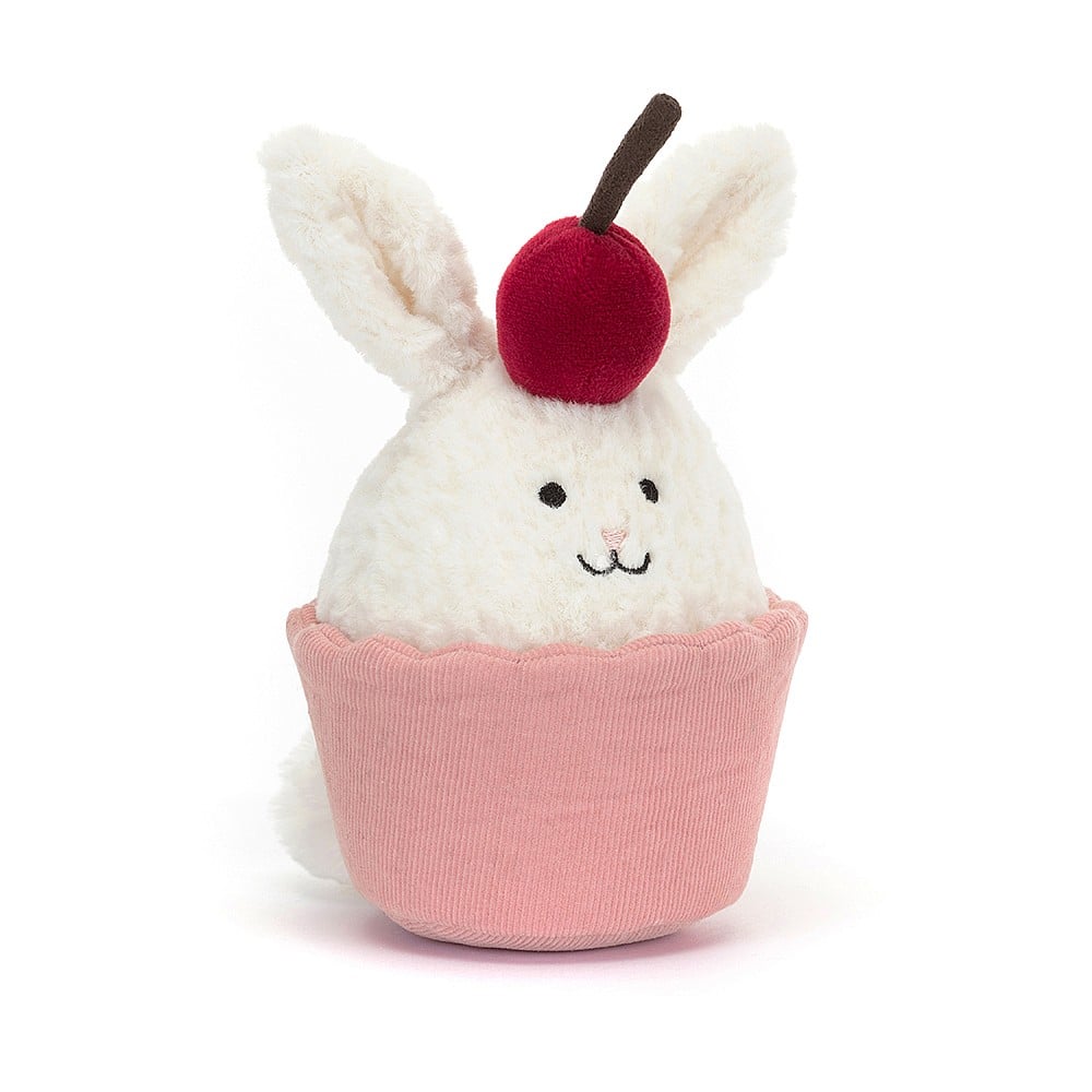 The Dainty Dessert Bunny Cupcake is gorgeously mixed-up. Inside that pink fine cord cake case there's a soft cream bunny masquerading as a treat! This long-eared bunny has textured fur and wears a bold cherry hat. There's even a bobtail peeping out! A cute gift with kawaii charm. Suitable from birth. 