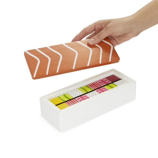 Love Nigiri? Then this is the Domino set for you! This charming wooden domino set is housed in a wooden 'bento' box full of Nigiri themed dominoes. A fun and whimsical reinvention of a classic game. Includes 28 pieces and a wooden box. Box dimensions: 3" c 8" x 2.5" Material: painted wood.