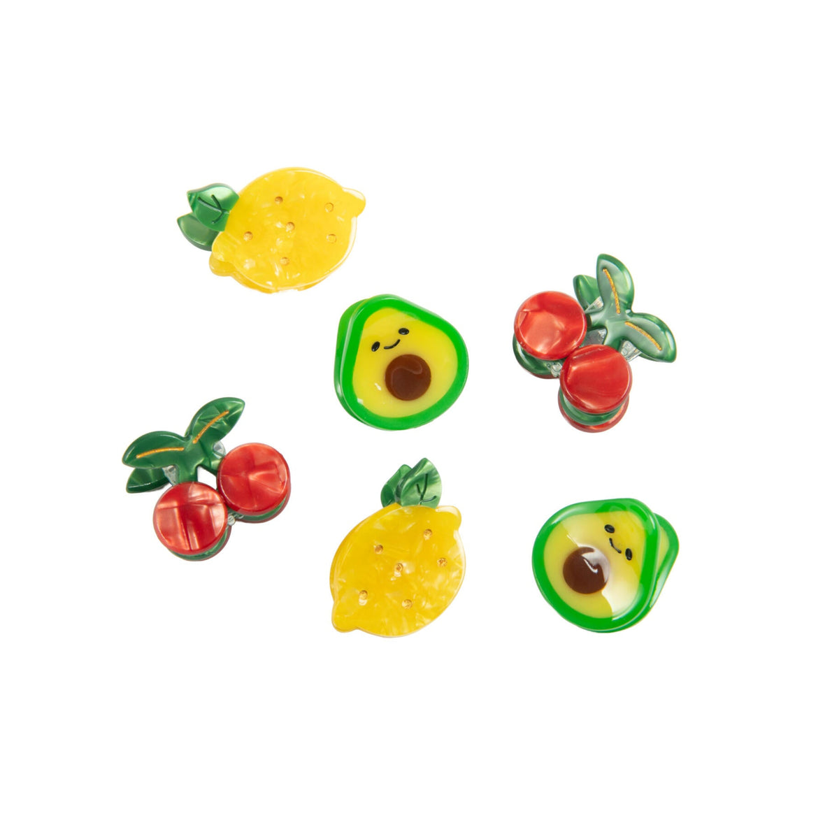 Set of colorful fruit-shaped mini hair clips on a white background