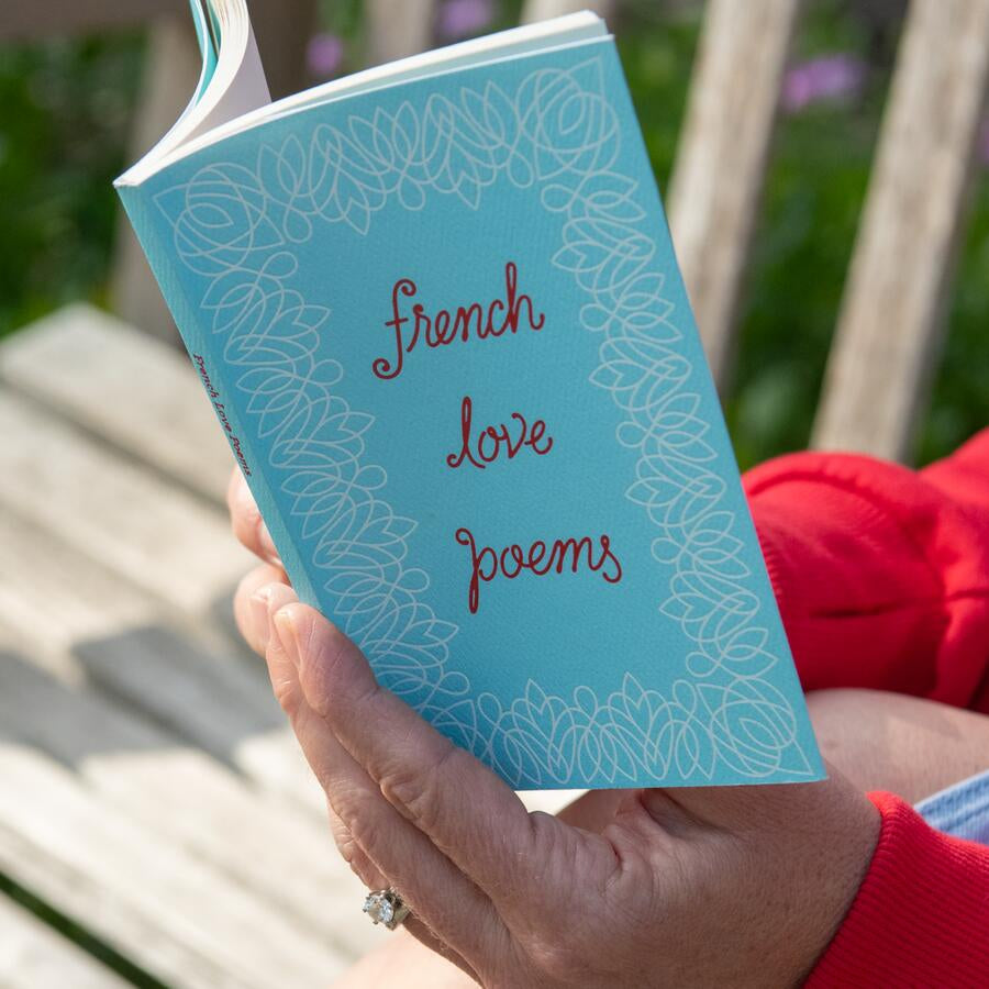 Book cover with 'French Love Poems' text on a light blue background