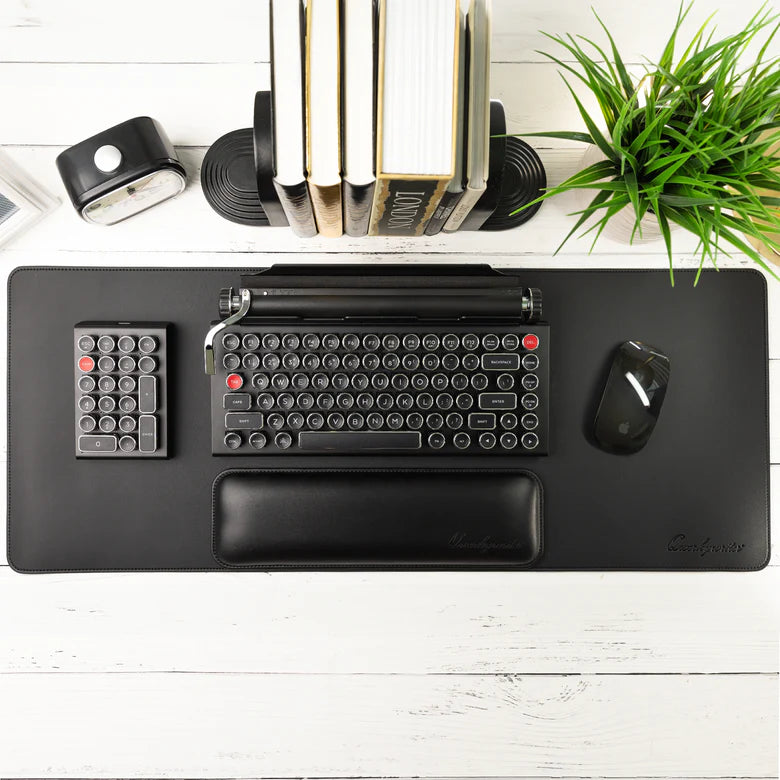 Black desk mat on a white background