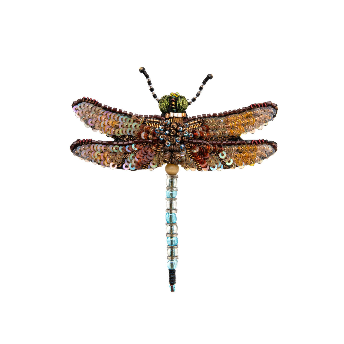 Decorative dragonfly brooch with sequins and beads on a white background