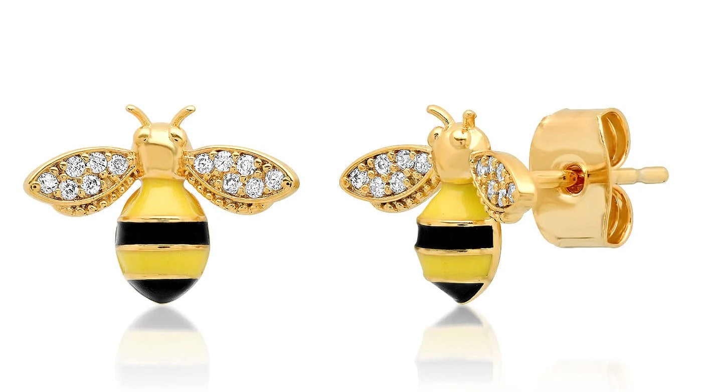 Create a buzz for all the right reasons with these dainty enamel bee stud earrings. These beautiful bees have crystal studded wings —perfect for adding a subtle touch of sparkle to your outfit. Materials: Gold plated brass, enamel, CZ crystals Dimensions: 0.45" x 0.25". Post fastening.