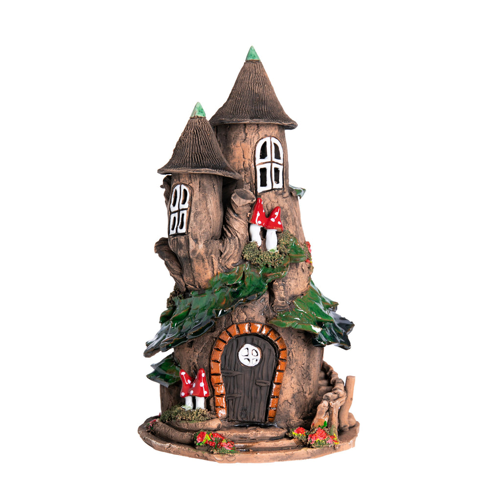 This charming double-turret fairy castle is crafted entirely by hand. Each intricately detailed model is unique. Place a tea-light or cone style incense inside the opening at the back, and the light will glow through the windows, and the smoke will gently swirl out of the chimney. Dimensions approx: 9.5" x 5".