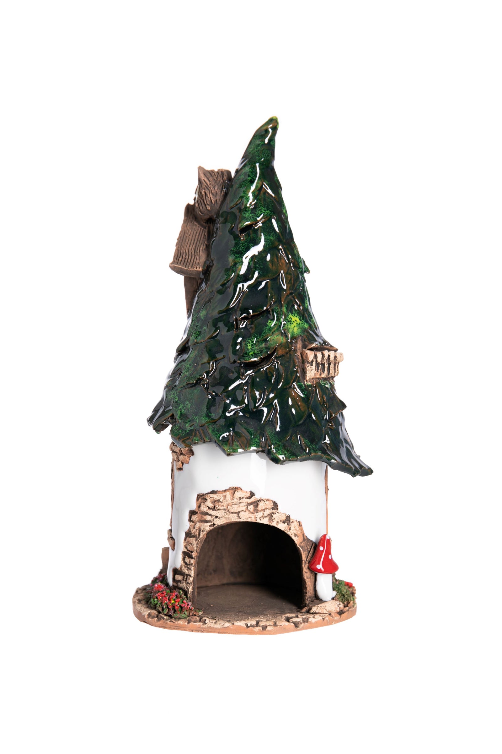 A hand-crafted ceramic fairy cottage with an owl on the roof, designed as a tealight holder.