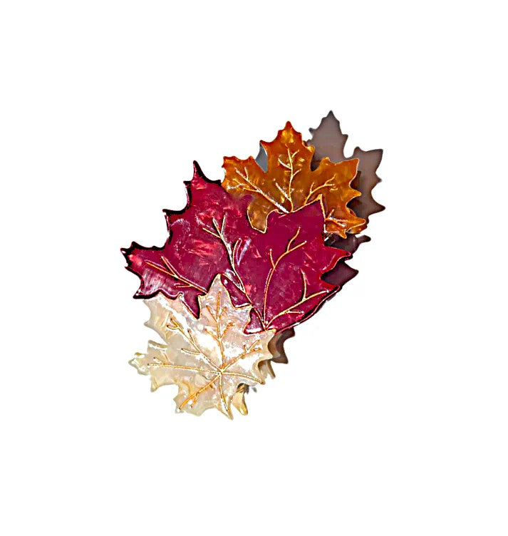 This fabulous hair clip shows three fall leaves gently drifting together for the perfect finishing touch to your autumn outfits. These unique hair clips are carefully crafted from cellulose acetate, an eco-friendly, biodegradable material made from recycled wood pulp. Dimensions: 2.5" x 4" .