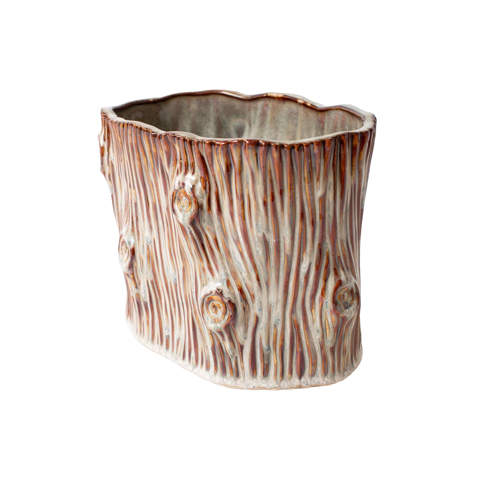 A ceramic planter shaped like a tree trunk, featuring a textured bark design with brown and beige tones, isolated on a white background.