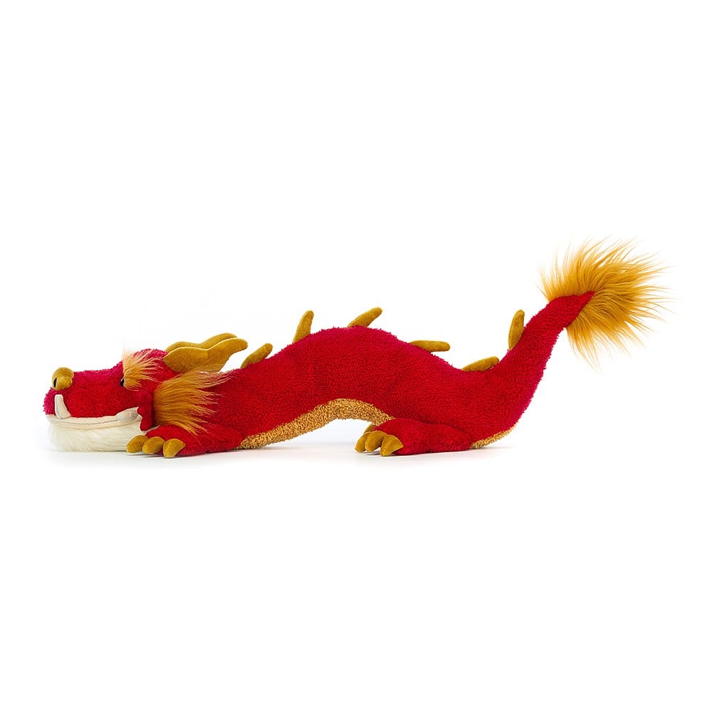 Festival Dragon is here to make a statement. A scarlet dragon with exquisite golden accents, from tummy to tail tip. Delicately finished with soft cheek tufts and suedette nose, horns, spines and claws. With a fluffy cream beard and wriggly body, this dragon is ready to dance! Dimensions: 17" x 4". 12+ months. 