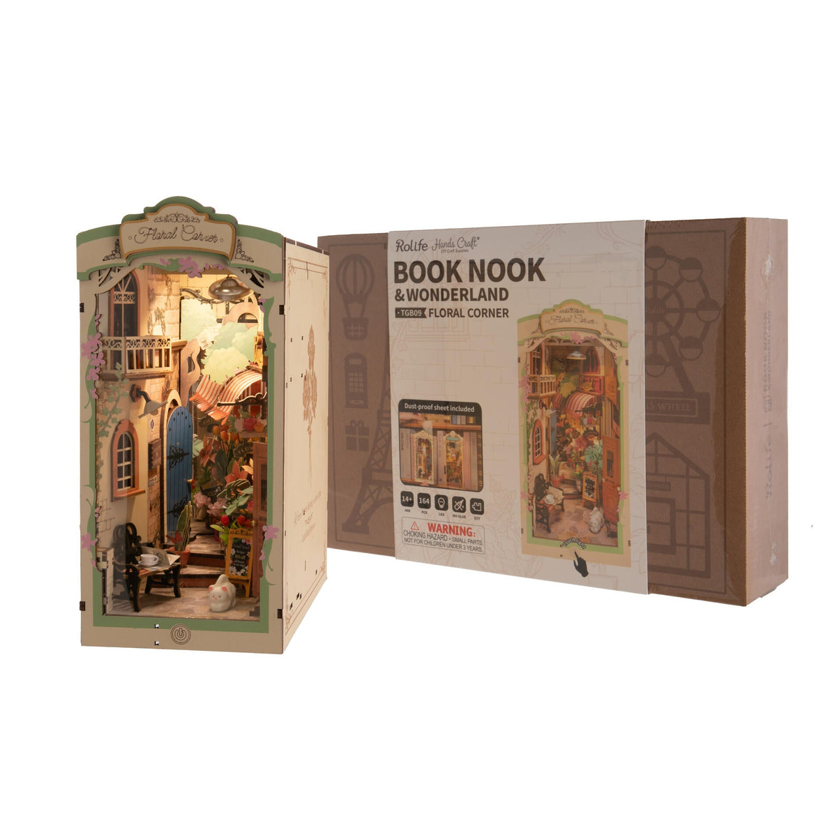 Miniature dollhouse with 'Book Nook & Wonderland' packaging on a white background