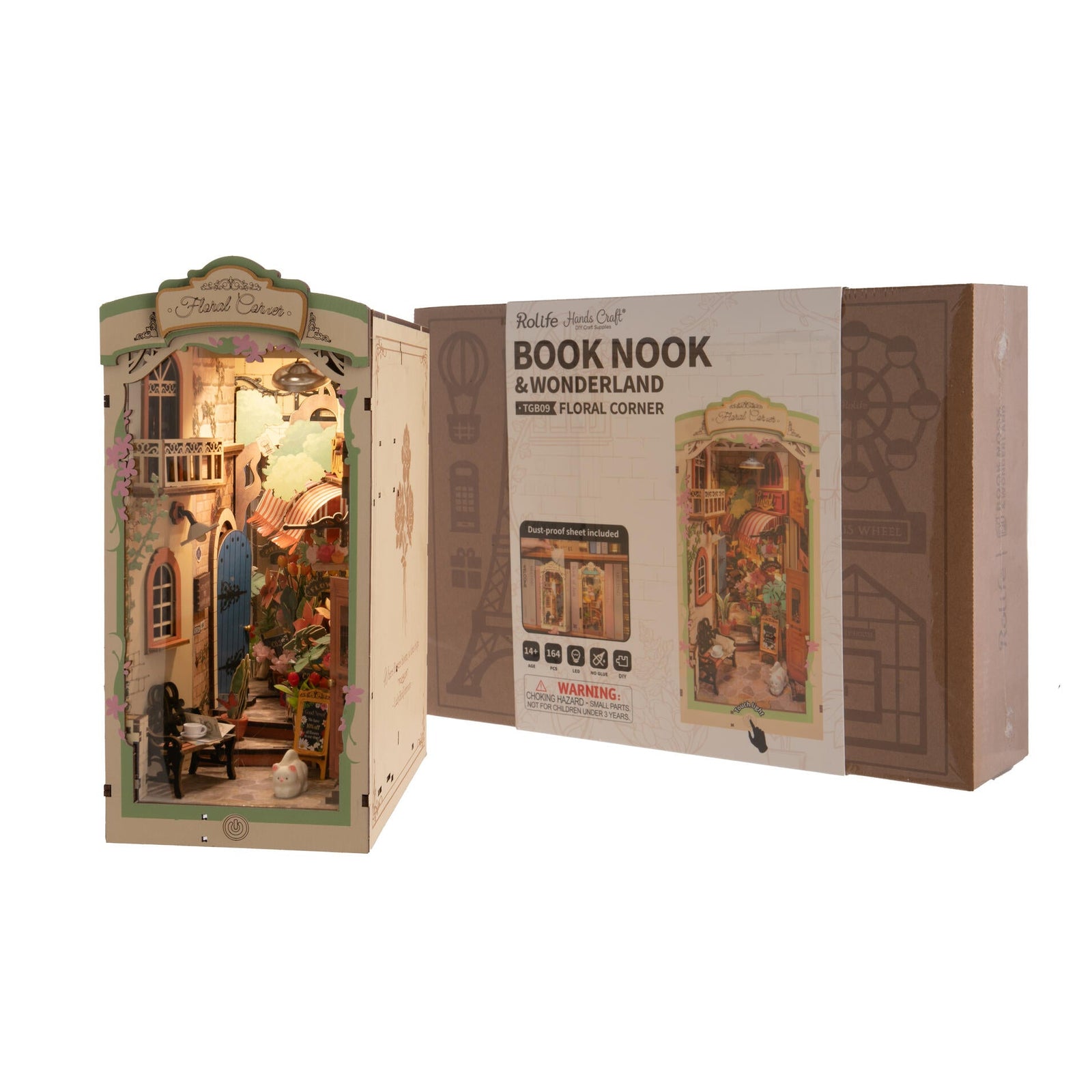 Miniature dollhouse with 'Book Nook & Wonderland' packaging on a white background