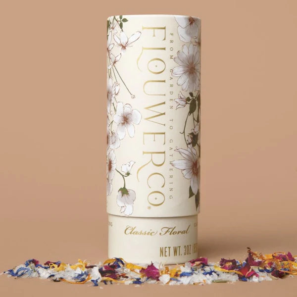 A cylindrical container of Flower Co.'s Classic Floral Garnishing Salt with a floral design on the label.
