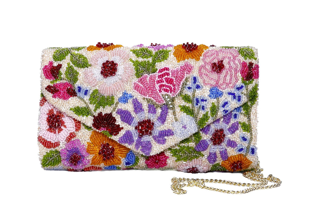 If you love beautiful blooms, this is the clutch purse you need! Completely encrusted in three-dimensional hand-applied artisan beadwork, this gorgeous purse features a magnetic snap fastening, optional gold chain shoulder strap and an interior slip pocket perfect for holding cards. Dimensions: 8.5" x 5" x 2".
