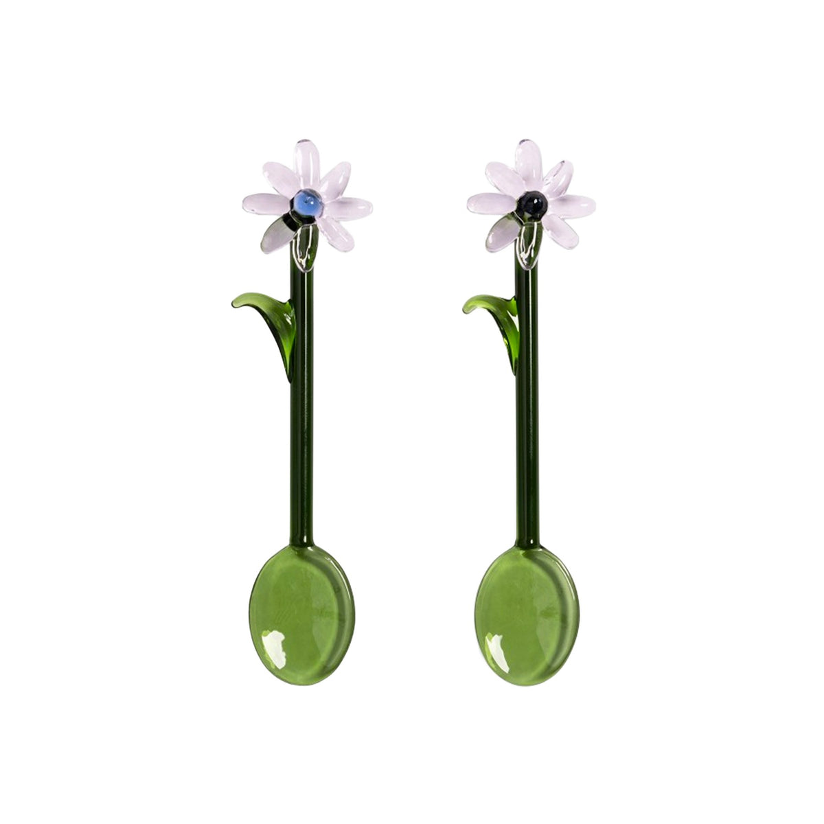 Pair of glass spoons with floral designs on a white background