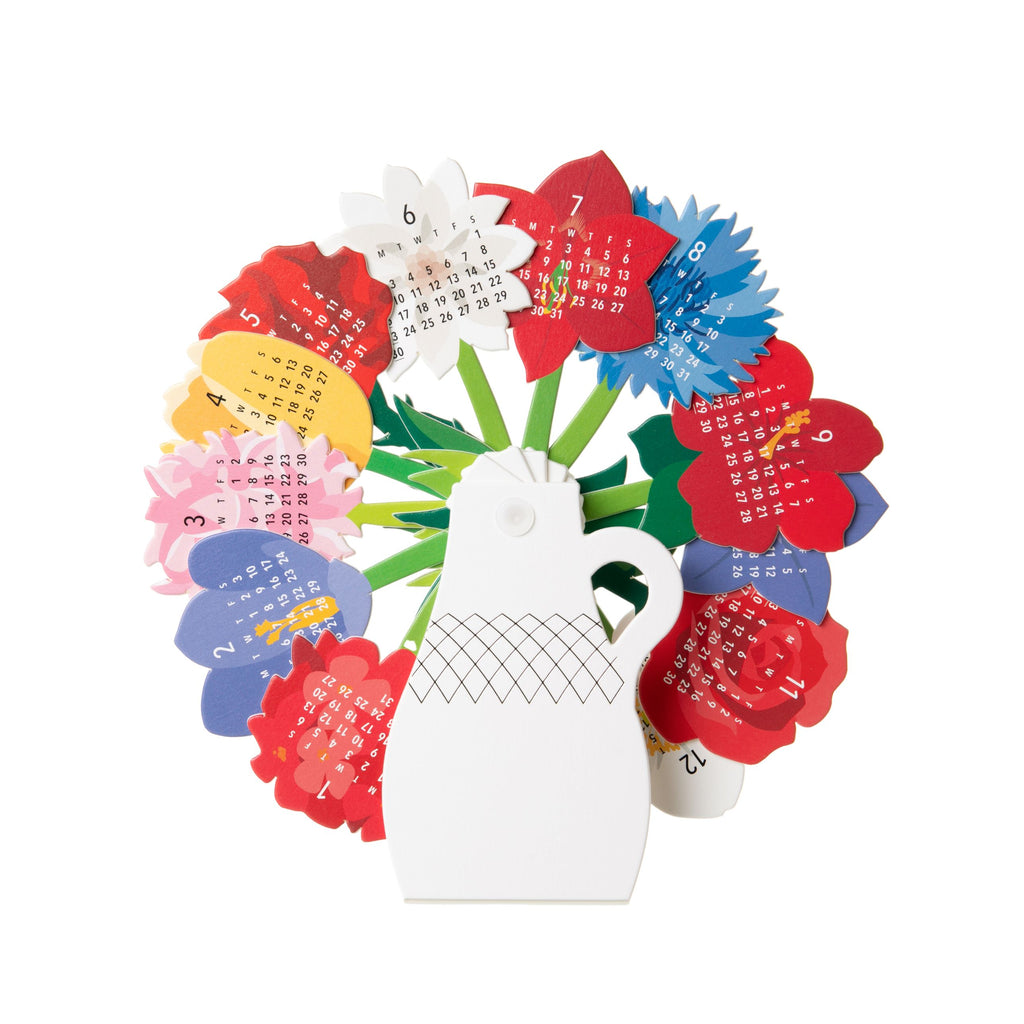 This unique desk calendar comprises of twelve different cut and printed flowers, tucked inside a paper vase, attached with a plastic bolt in the center, so that they swing up easily as you need them. Each month, swing up a fresh new flower for the most charming way to count the days! Dimensions when folded: 2.5"x 4"x1"