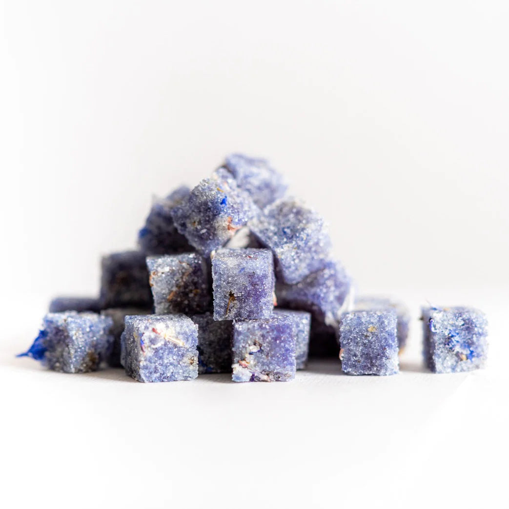 Elevate any occasion with these floral-infused Cocktail Cubes! Add a cube to champagne or muddle a few with seltzer or your favorite spirit for a beautiful floral finish to any libation. Crafted using only organic French Lavender, Wolfberry, Butterfly Pea Flower, all-natural extracts, and plant-based ingredients. 2 oz.